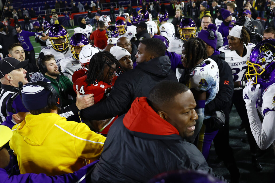 Referee bloodied, eight ejected in ugly NC State-East Carolina Military Bowl brawl