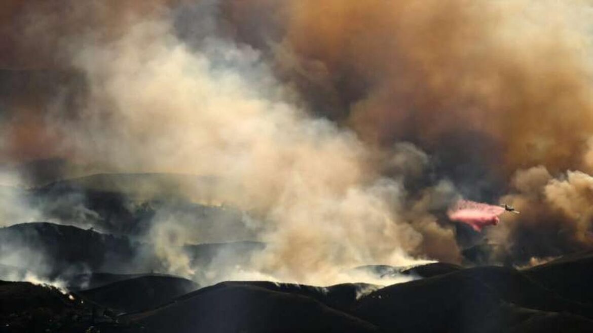 Air tankers fight Los Angeles fires from frantic skies