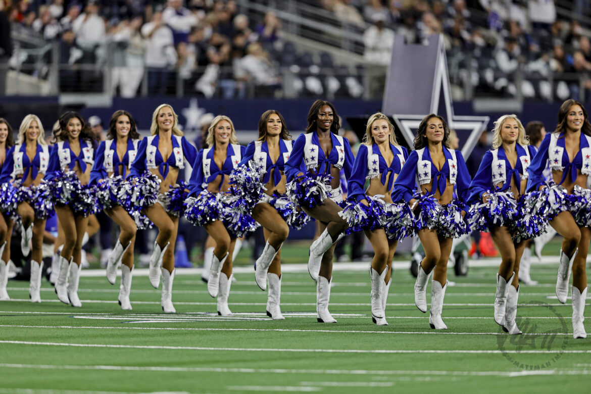 Dallas Cowboys Cheerleader Gets Knocked Down By Football During Kickoff