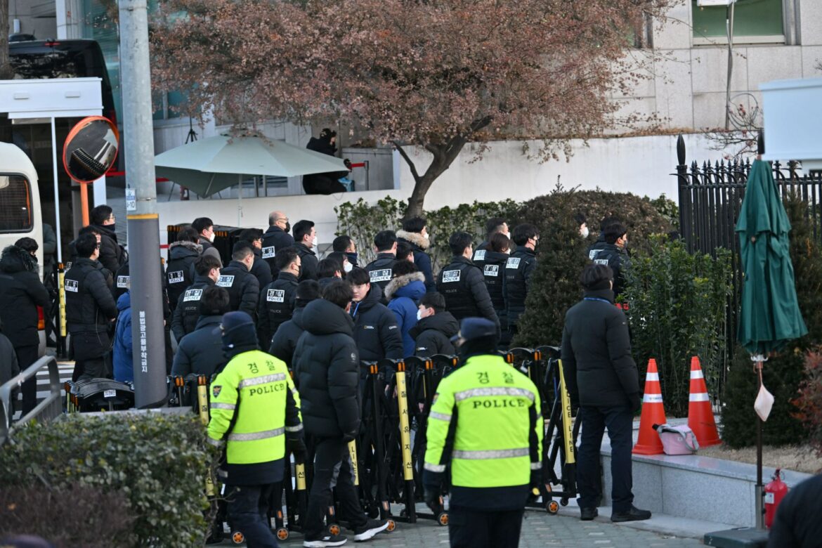 Riot police swarm home of impeached South Korean president after he imposed martial law as he vows to ‘fight to end’